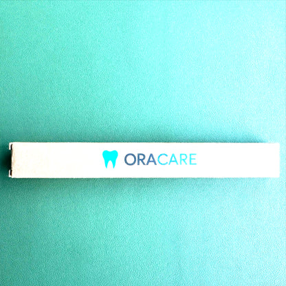ORACARE product box on a teal background